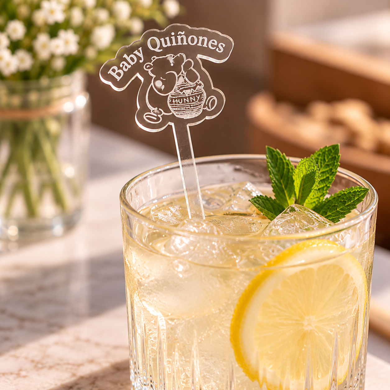 Baby Quiñones personalized clear acrylic drink stirrer styled in a glass