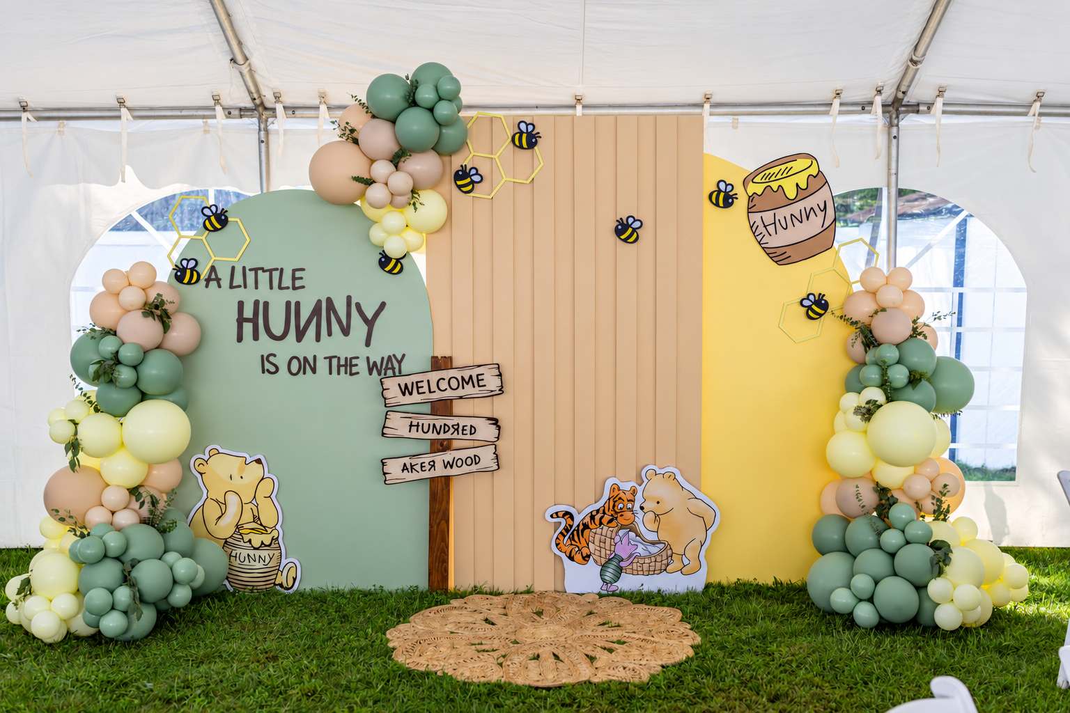 Custom wooden arch and panel backdrop with balloon décor for a baby shower
